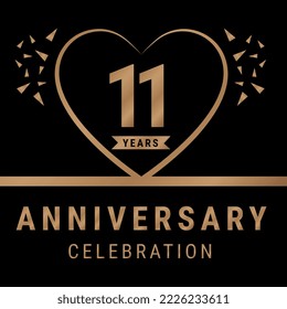 11 years anniversary celebration logotype. anniversary logo with golden color isolated on black background, vector design for celebration, invitation card, and greeting card. Eps10 Vector Illustration