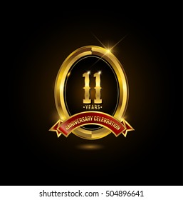 11 years golden anniversary logo with red ribbon and oval ring