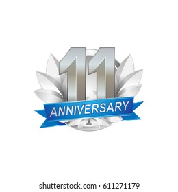 11th Anniversary logo with silver wreath, silver number, blue ribbon