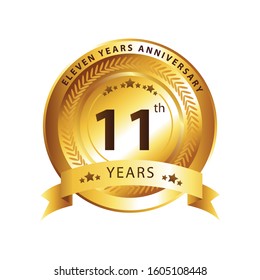 11th years golden anniversary logo celebration with ring and ribbon.