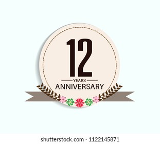 12 years anniversary with vintage style soft brown circle and flower isolated on white background