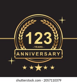 123 years anniversary golden color with circle ring and stars isolated on black background for anniversary celebration event luxury gold premium vector