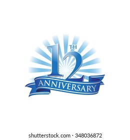 12th anniversary ribbon logo with blue rays of light