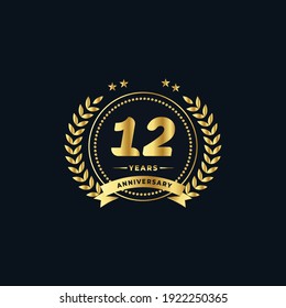 12th golden anniversary logo, with shiny ring and golden ribbon, laurel wreath isolated on navy blue background