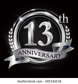 13th silver anniversary logo with ring and ribbon. silver anniversary laurel wreath design.