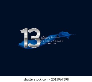13th Years Anniversary celebration logotype silver colored with blue ribbon and isolated on dark blue background