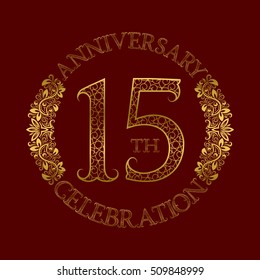 15th anniversary celebration vintage patterned logo symbol. Golden circular ornate emblem on red.