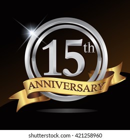 15th anniversary logo, with shiny silver ring and gold ribbon isolated on black background. vector design for birthday celebration.