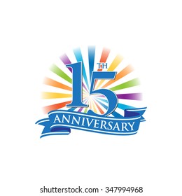 15th anniversary ribbon logo with colorful rays of light