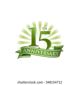 15th anniversary ribbon logo with green rays of light