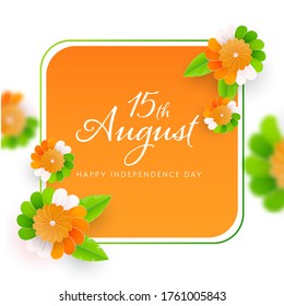 15th August Happy Independence Day Font on Saffron and White Background Decorated with Paper Flowers.