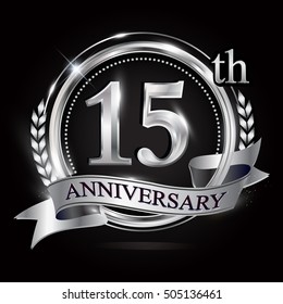 15th silver anniversary logo with ring and ribbon. silver anniversary laurel wreath design.