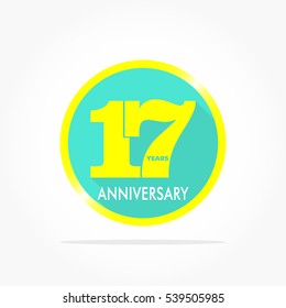 17 years anniversary logo vector on flat design blue circle with yellow number and gradient yellow frame with shadow effect