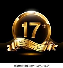 17 years golden anniversary logo celebration with ring and ribbon.