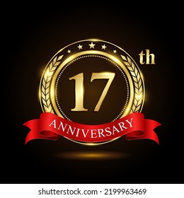 17th golden anniversary logo, with shiny ring and red ribbon, Laurel wrath isolated on black background, vector design