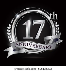 17th silver anniversary logo with ring and ribbon. silver anniversary laurel wreath design.