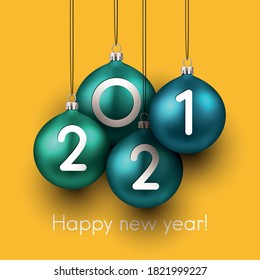 2 0 2 1 white numerals inside green and blue christmas tree toys hanging on threads. Happy new year sign. Orange background. Vector holiday illustration.