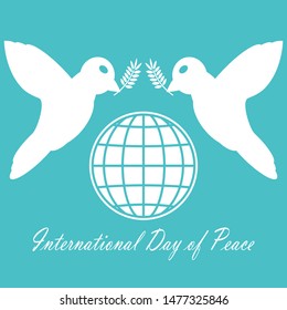 2 Doves, flying and carrying olive branch. The great symbol of love and peacefulness and the sign of the International Day of Peace  