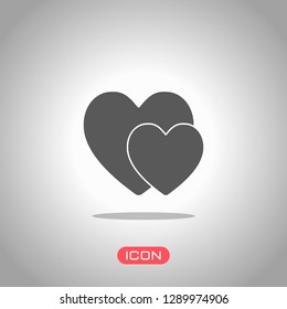 2 hearts. Simple icon. Icon under spotlight. Gray background