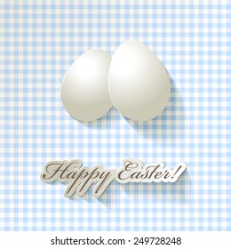 2 white eggs Easter greetings in English on checkered background