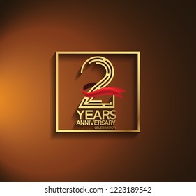 2 years anniversary golden color with square and red ribbon for celebration event
