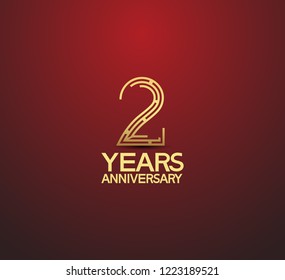 2 years golden anniversary logotype with labyrinth style number isolated on red background
