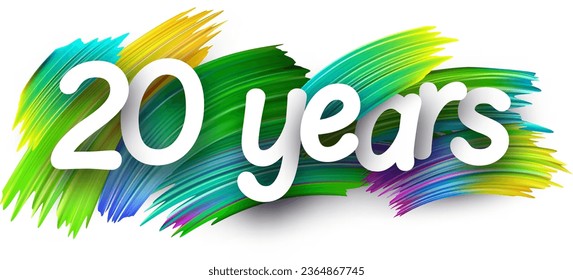 20 years paper word sign with colorful spectrum paint brush strokes over white. Vector illustration.