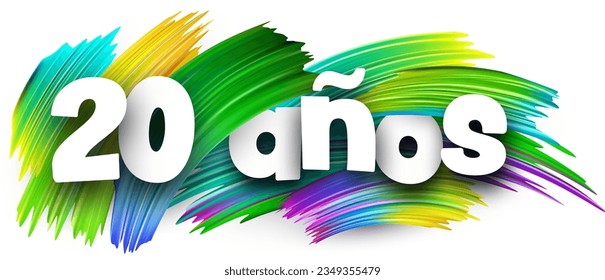 20 years at spanish paper word sign with colorful spectrum paint brush strokes over white. Vector illustration.