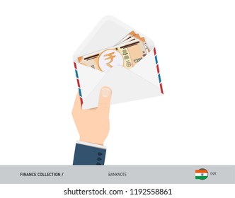 200 Indian Rupee Banknotes in envelope hold in hand. Flat style opened white envelope with cash. Salary payout or corruption concept.