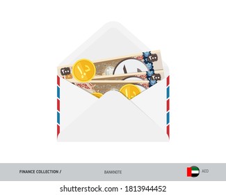 200 Dirham Billetes y monedas de los Emiratos Árabes Unidos. Sobre abierto de estilo plano con dinero en efectivo. Concepto de pago de salarios o corrupción.