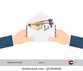 200 United Arab Emirates Dirham Banknotes in envelope hold in hand. Flat style opened white envelope with cash. Salary payout or corruption concept.