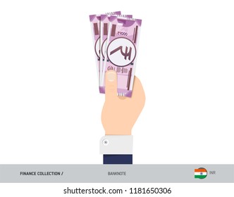 2000 Indian Rupee Banknote. Hand gives money. Flat style vector illustration. Salary payout or corruption concept.