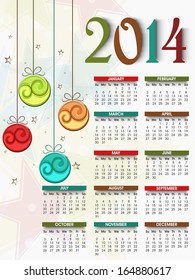 2014 year calendar, decorated with hanging Xmas balls and colorful text. 