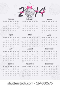 2014 year calendar with Xmas ball on grey background. 