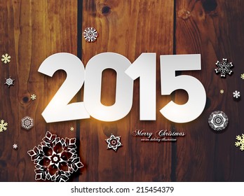 2015 Origami Happy New Year Greeting Card. Wood Background. Paper Snowflakes.