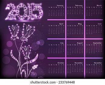 2015 year calendar, decorated with beautiful floral design on purple background.
