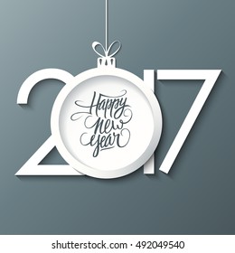 2017 Happy New Year greeting card with handwritten text design and christmas ball. Holiday hand drawn lettering. Vector illustration.