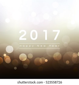 2017 Happy New Year text on abstract bokeh background