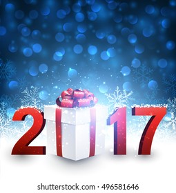 Fondo azul de Año Nuevo 2017 con regalo y copos de nieve. Ilustración vectorial.