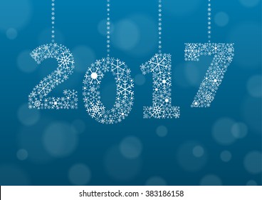 2017 text made of snowflakes on background with bokeh effect and enough copyspace for you text