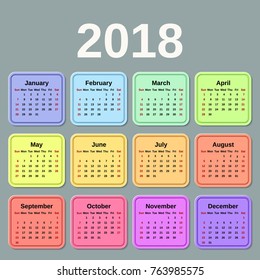 2018 Calendar year. Week starts Sunday. Vector graphics. Colorful design stationery template. Yearly calendar organizer on gray background.