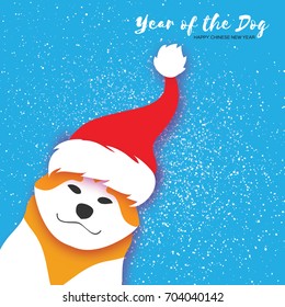 2018 Chinese year of the Dog. Happy Chinese New Year Greeting Card. Paper cut Akita Inu doggy with santa claus red hat. Snow Celebration. Place for text. Vecto