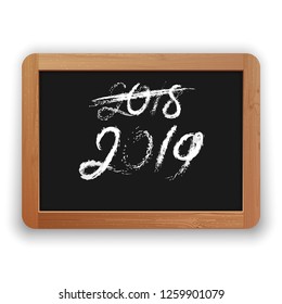 2018 crossed out and 2019. Hand written chalk calligraphy on the blackboard. Isolated on white background. Clipping paths included.