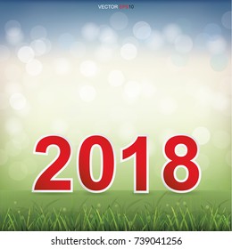 2018 Happy New Year with grass field and light blurred bokeh background. Vector illustration.