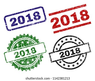 2018 seal prints with corroded texture. Black, green,red,blue vector rubber prints of 2018 tag with corroded texture. Rubber seals with circle, rectangle, medal shapes.