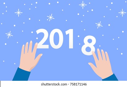 2018 year hands are numbers on a blue background with snowflakes