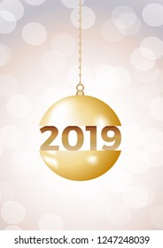 2019 Happy New Year ball on iridescent glitter festive empty background. Shiny sparkles swirling in air.