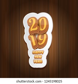 2019 Happy new year creative design background or greeting card with colorful numbers and greeting text. Happy new year label or icon isolated on wooden background