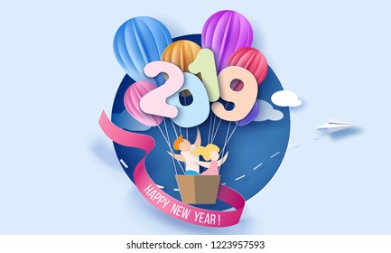 2019 New Year design card with kids in round hole on blue background. Vector paper art illustration. Paper cut and craft style.