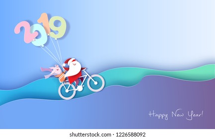 2019 New Year design card with Santa Claus and funny pig on bicycle on blue sky background with hills. Vector paper art illustration. Paper cut and craft style.